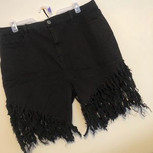 Black fringe jean shorts